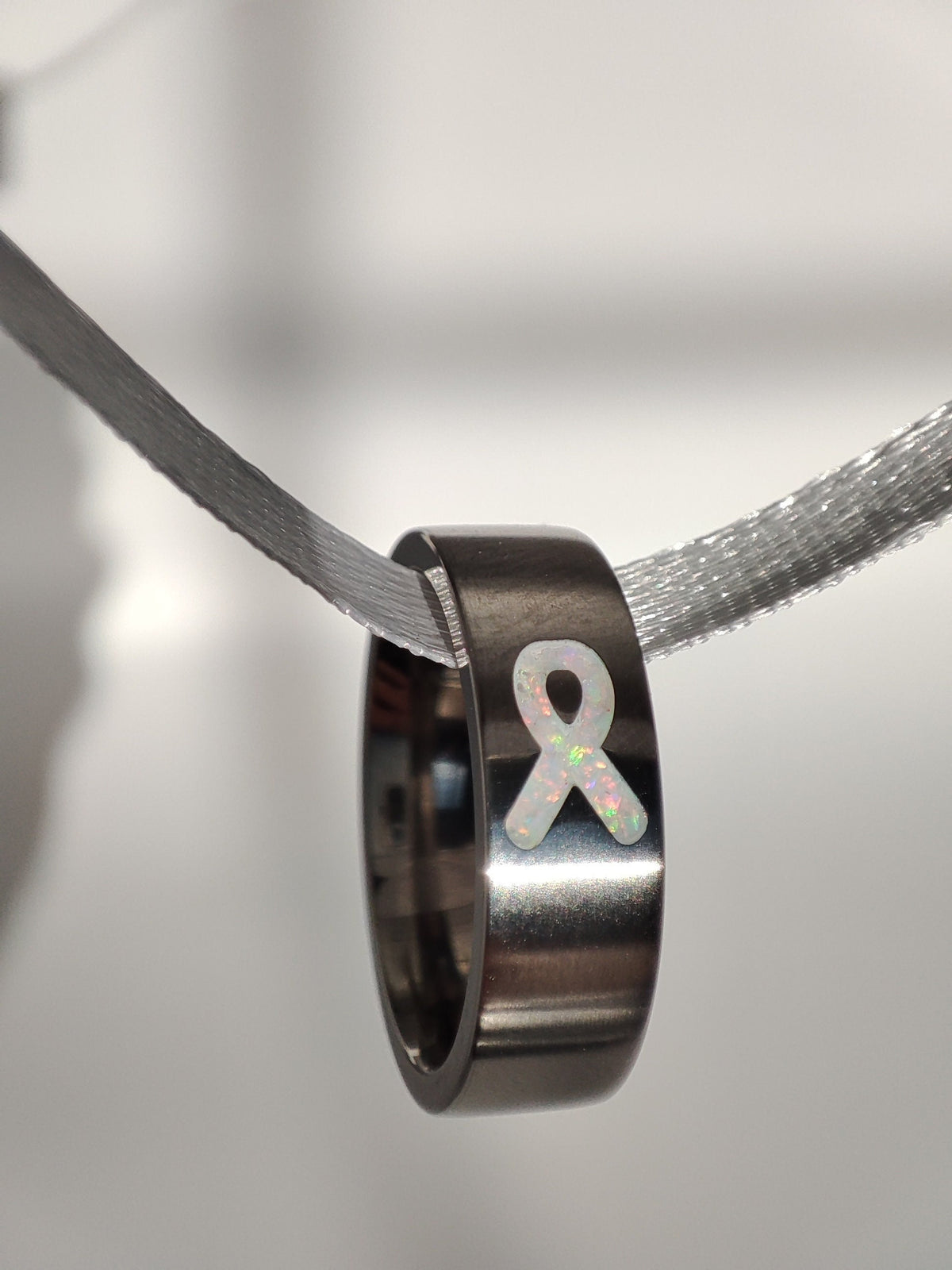 White Awareness Ribbon Opal Ring - Titanium