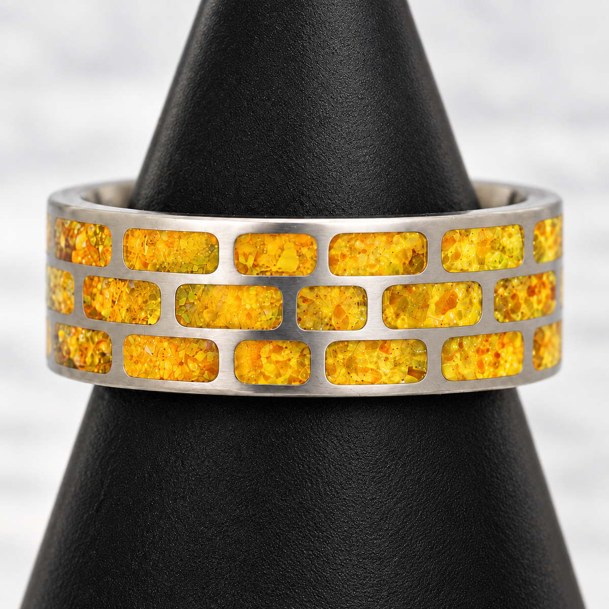 Yellow Brick Road brushed titanium ring with golden citrine opal in daylight